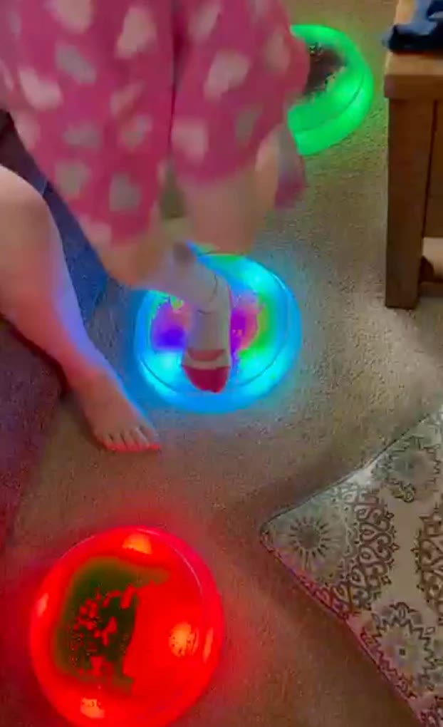 A child’s foot on a glowing stone at home